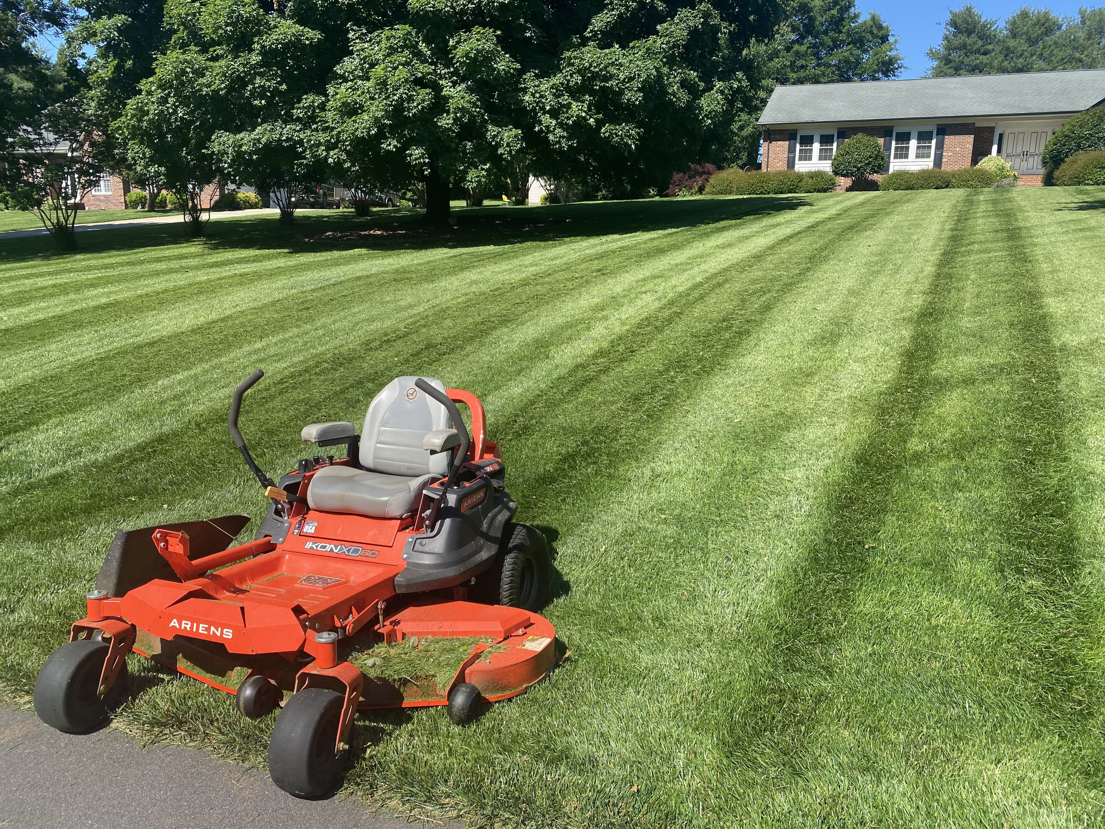Striped lawn maintained by Mooe's Landscaping
